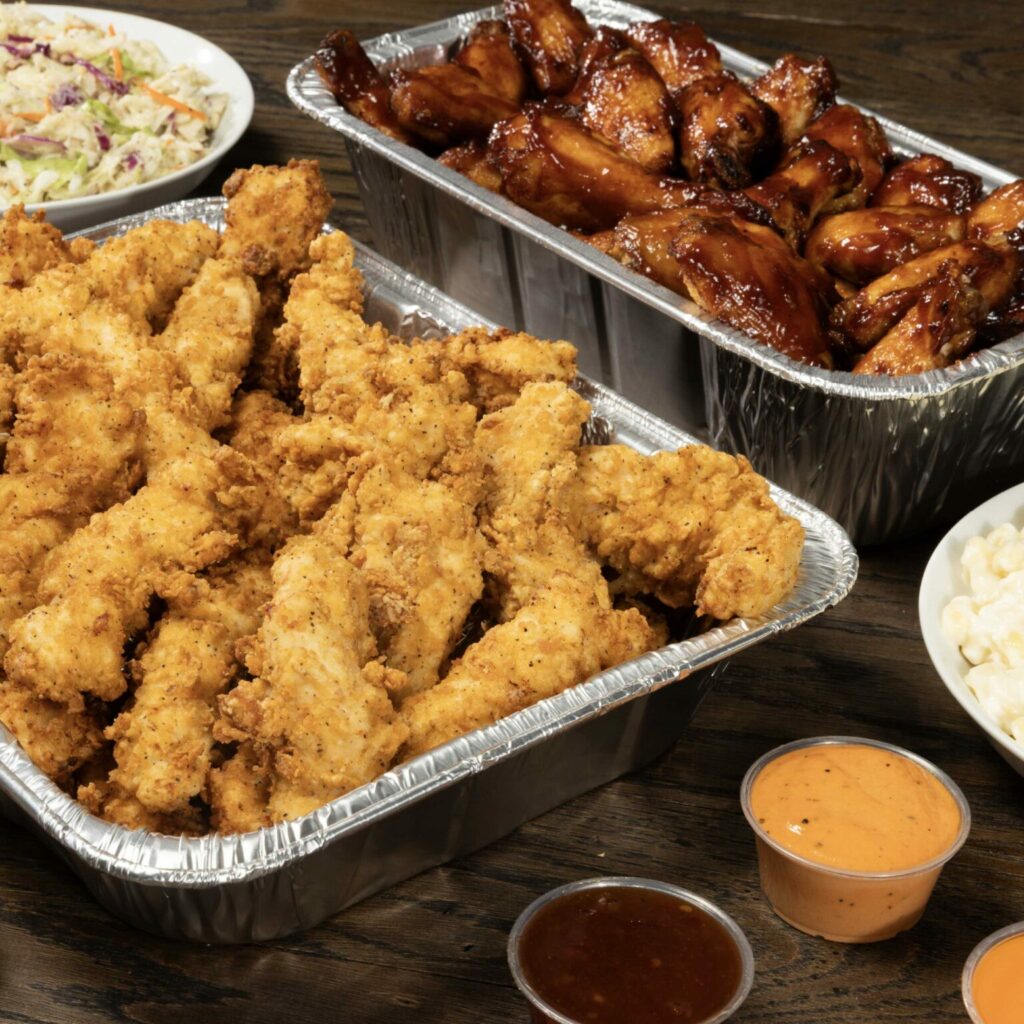 A tray of slim chickens tenders and wings along with sauces that will be served at the new Moncks Corner location of the restaurant near Charleston